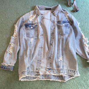 Light Wash Denim Jacket with Distressed Detailing
